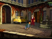 Animated gameplay of a young white man climbing out of a drain into a grand estate