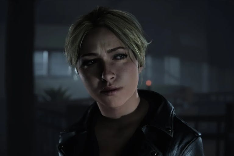 Gameplay of a shadowy dark room with a white woman with blonde hair looking concerned