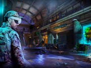 VR game still of a white man in army clothing and a VR headset in a deserted and rundown shopping centre