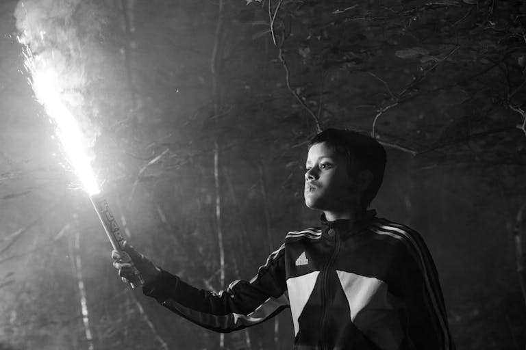 boy holding flare