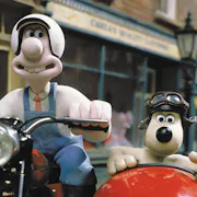 Stop motion animation of a white man on a motorcycle and a dog sitting in a red sidecar