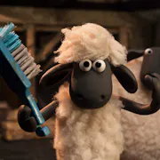 Stop motion claymation of a lamb using a brush to comb his hair with a bigger sheep behind him