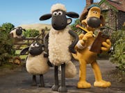 Stop motion claymation of a sheep, a little lamb and a brown dog outside a farmhouse and field