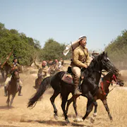 A small group of Palestinian men galloping on horses