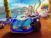 CGI animation of a grey female mouse sat in a blue race car with cars around her, a bear in a white car and a sea creature with tentacles behind her