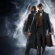Two men in trench coats; one looking at the camera holding a briefcase and the other facing away