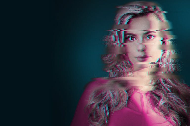 A distorted image of a blonde woman facing the camera