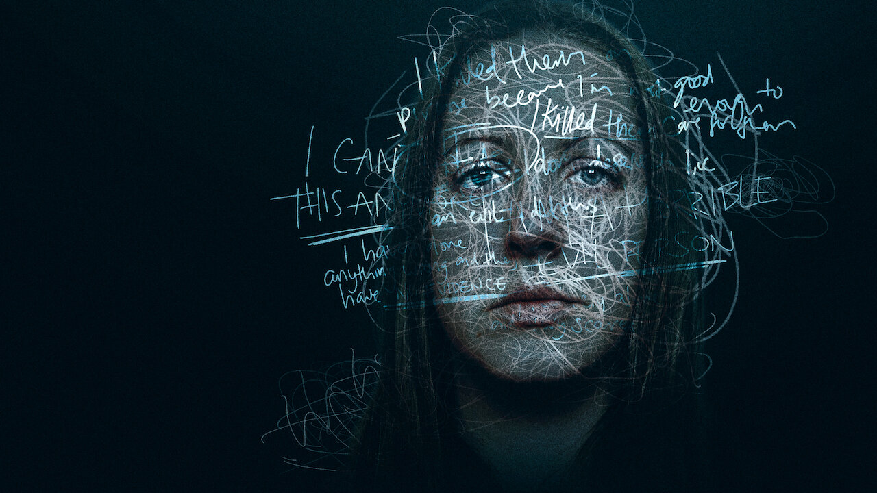 A white woman's face has projected words scribbled over it.