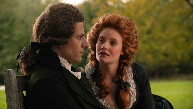 A woman and man sitting on a park bench, dressed in 18th Century attire