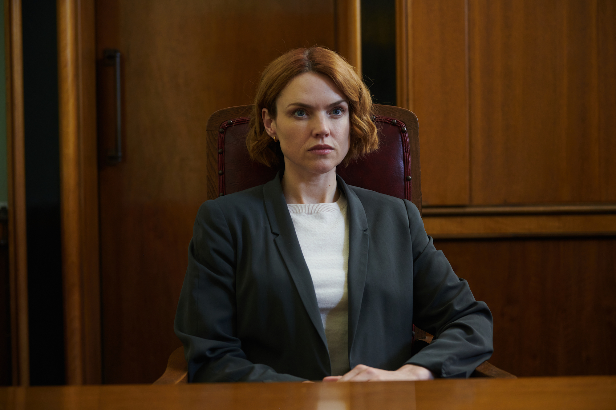 A woman sitting in a courtroom
