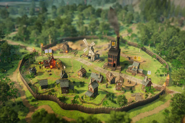 A birds-eye view of a grassy, medieval-looking village