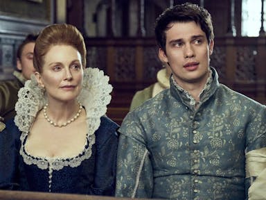 An older white woman and a young white man in fine 17th Century clothing 