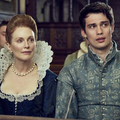 An older white woman and a young white man in fine 17th Century clothing 