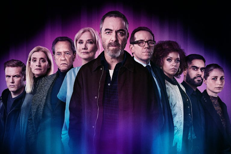 A group of serious looking people staring at the camera with a purple glow around them