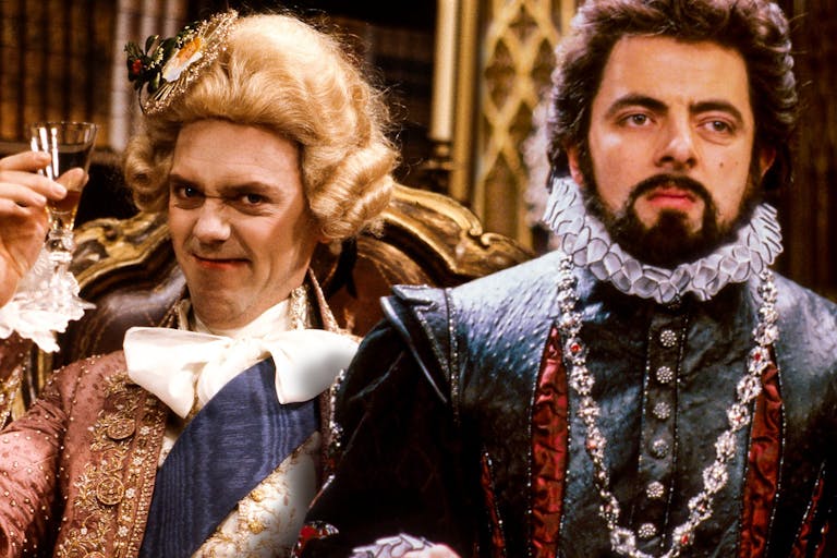 Two white men in ostentatious Elizabethan clothing   