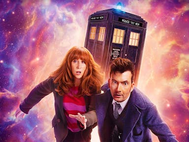 A red headed white woman and a dark haired white man in long blue coat, run away from cosmic galaxy activity with the TARDIS, a blue police box, in the background