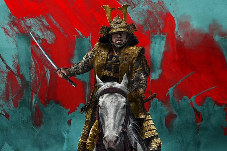 An older Japanese man in elegant armour sitting on a white horse brandishing a sword, with red and blue background silhouette of other soldiers