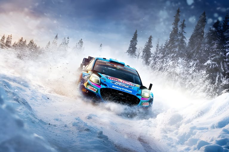 Gameplay of a blue racing car, whizzing through a snowy terrain with tall snow-tipped trees in the background