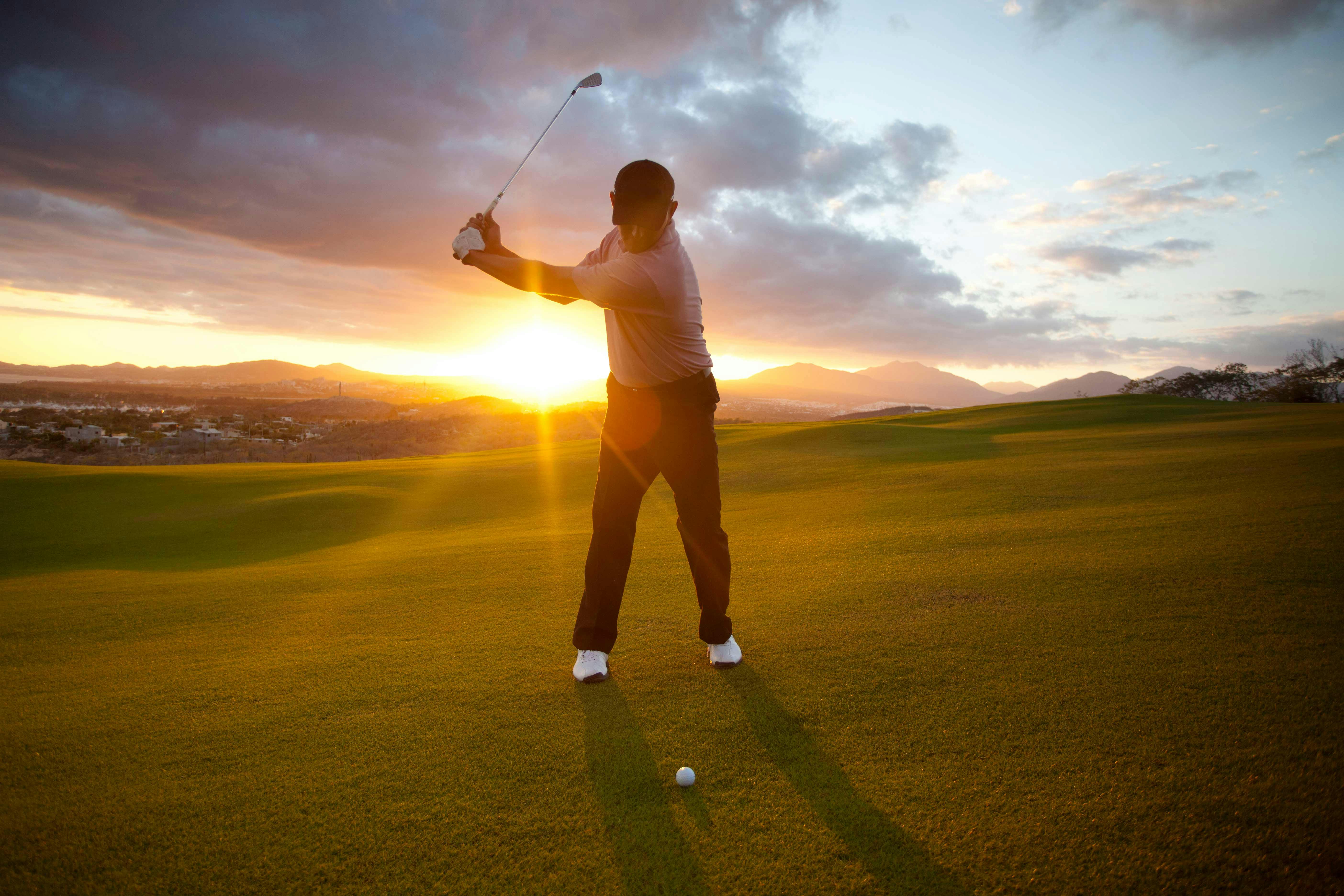 Golfer at sunset
