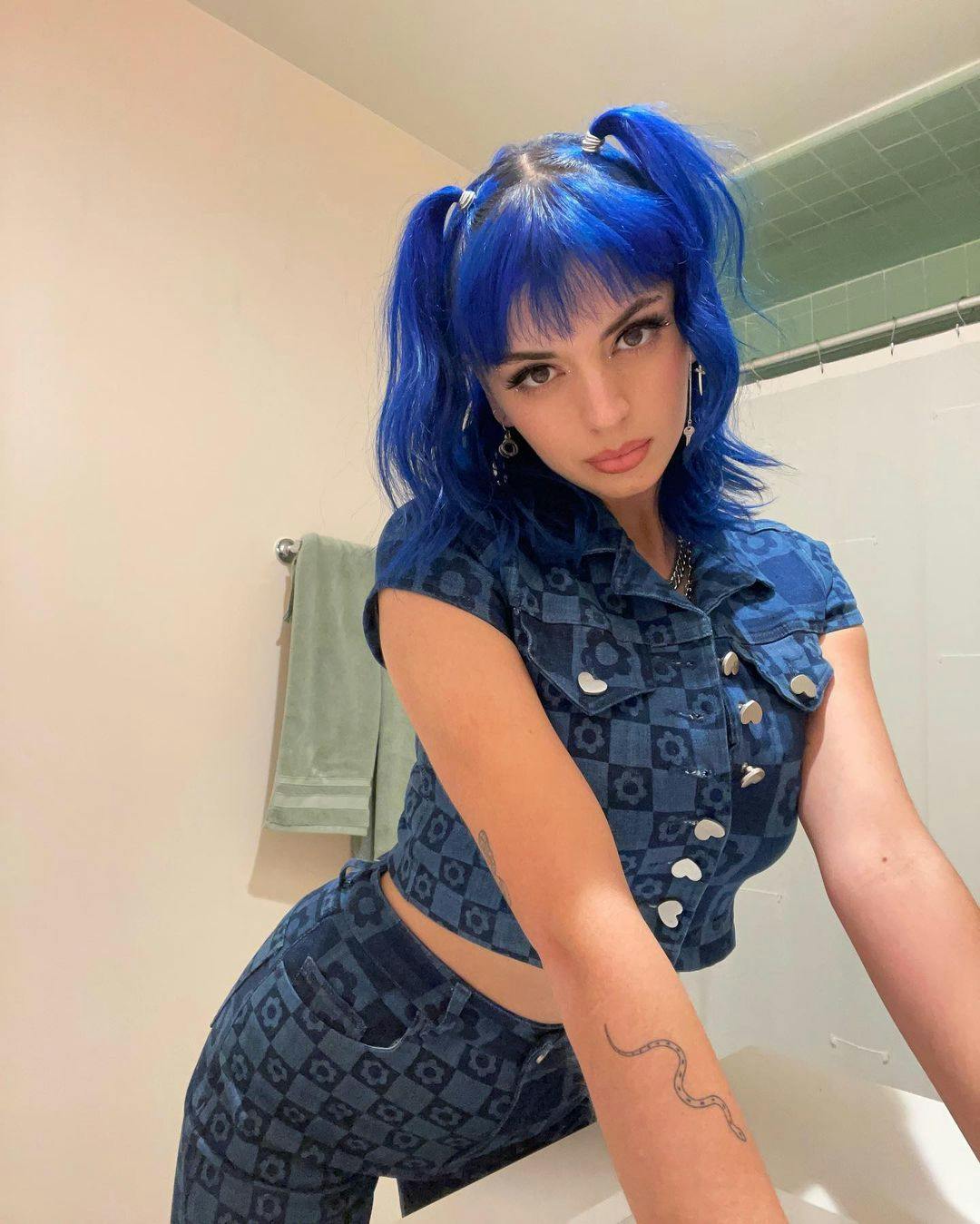 Rebecca Black in a blue outfit by Jaded London.