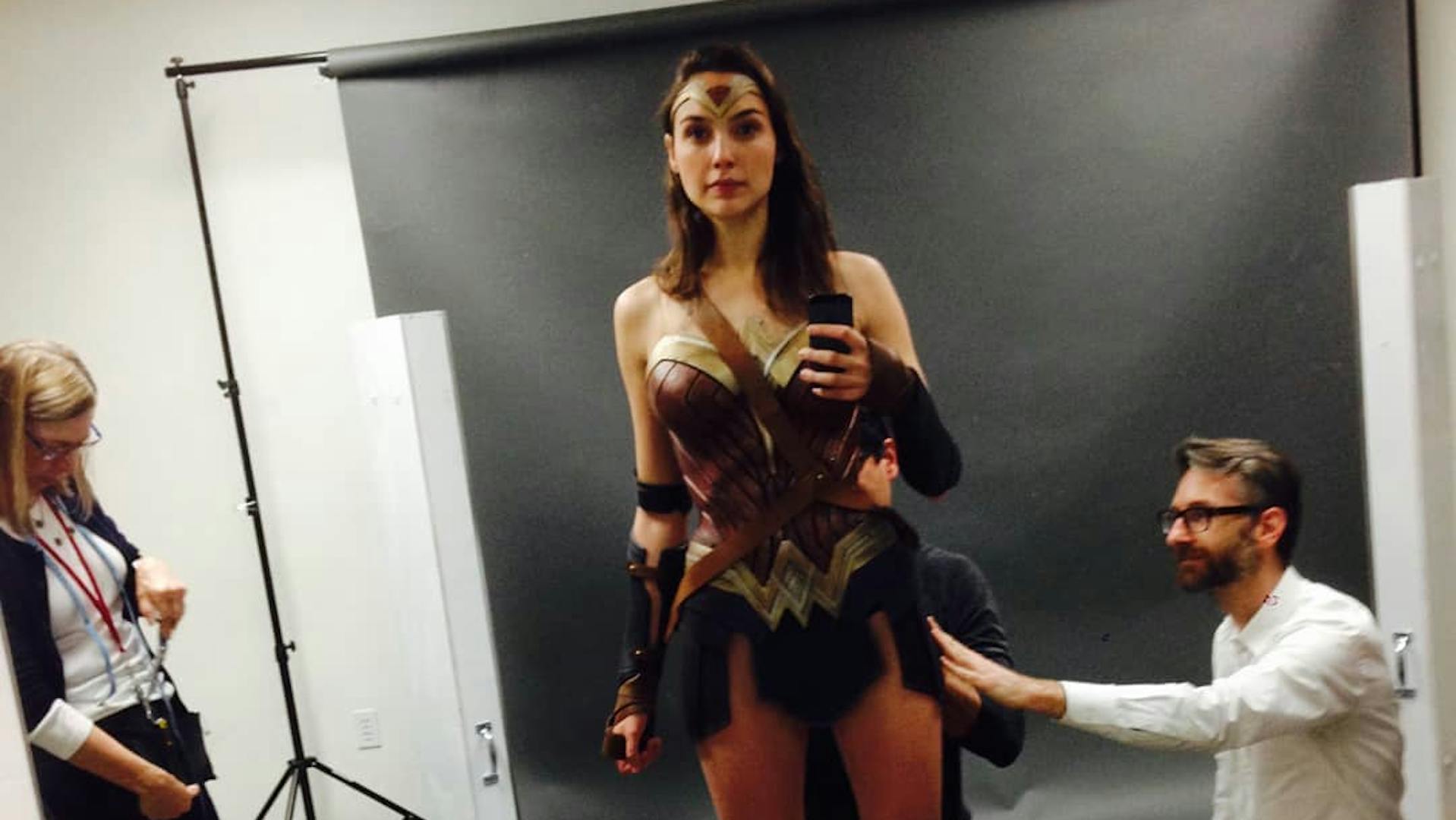 Gal Gadot taking a selfie in costume