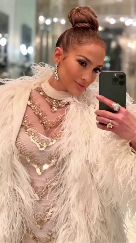 JLo taking a selfie.