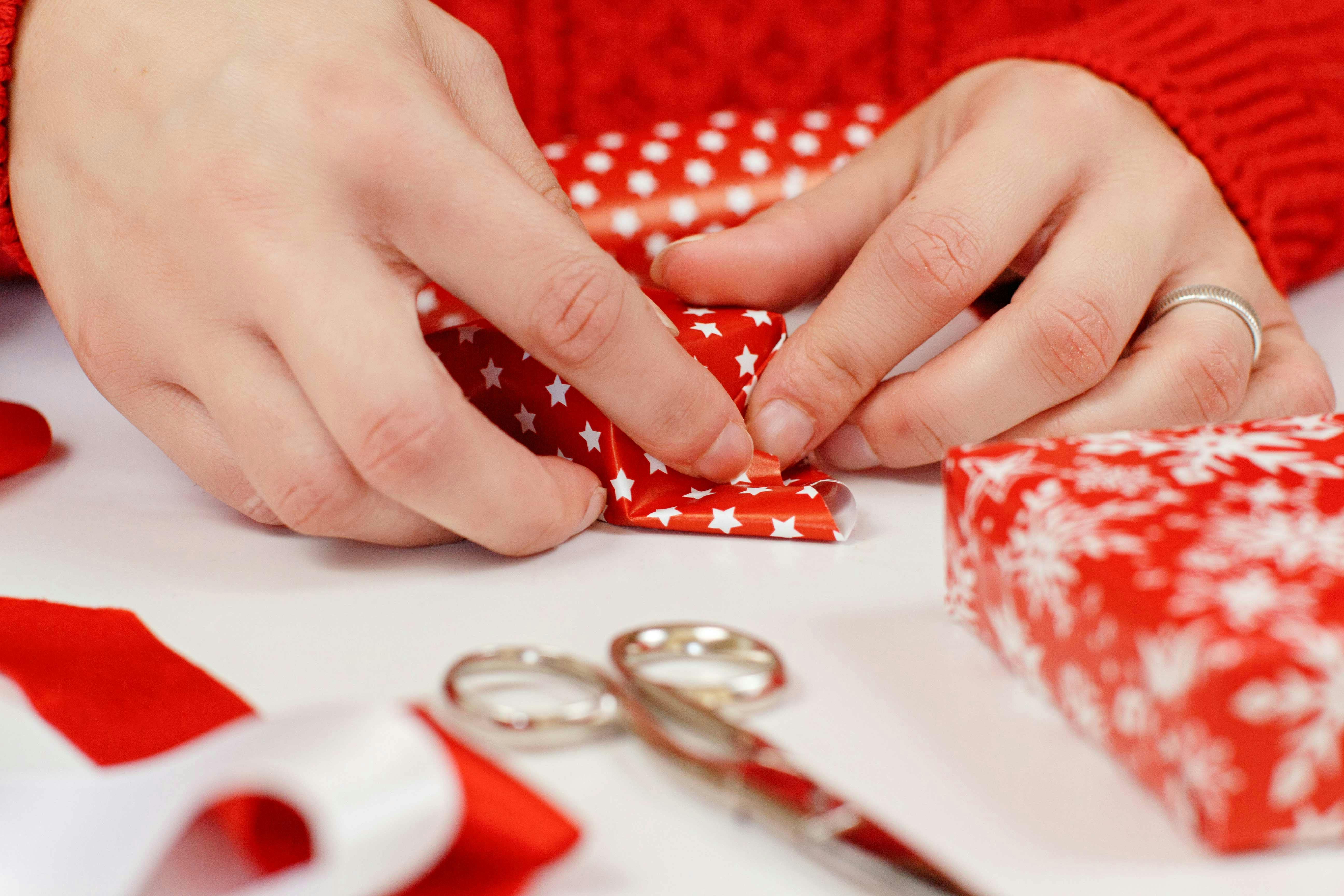 Woman wrapping a present.