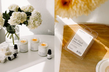 Three Marée soy candles in the scents Coton Gardénia, Coco Litchi, and Baie d'Açaï Concombre displayed with matching fragrance oils, while a Baie d'Açaï Concombre soy wax melt sits on a wooden surface beside a bouquet of white flowers.