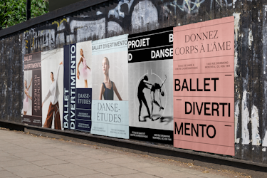 A large outdoor advertising display composed of multiple posters for Ballet Divertimento installed along an urban wall. The visuals sequentially present the texts “BALLET DIVERTIMENTO,” “JEUNESSE RÉCRÉATIVE,” “DANSE ÉTUDES,” “PROJET BD DANSE,” and a pink poster displaying “DONNEZ CORPS À L’ÂME,” “ÉCOLE DE DANSE & CENTRE CHORÉGRAPHIQUE,” “1435 RUE DRUMMOND, MONTRÉAL, QC H3G 1W4,” and “BALLET DIVERTIMENTO.” The posters feature photographs of dancers in motion, choreographic silhouettes, and graphic elements inspired by Benesh notation.