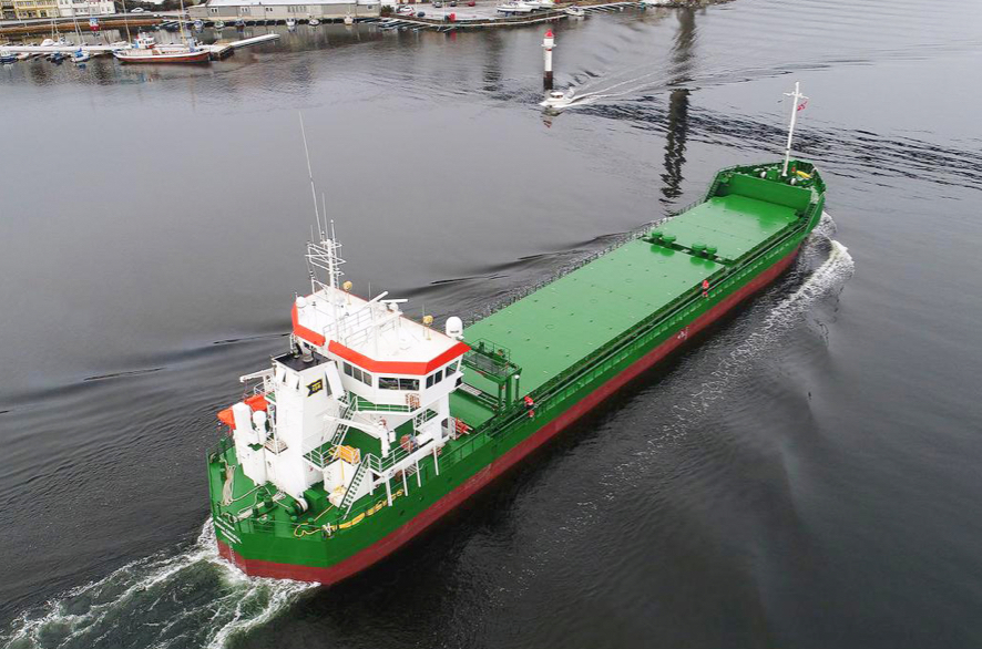 A bulk carrier approaching a bridge