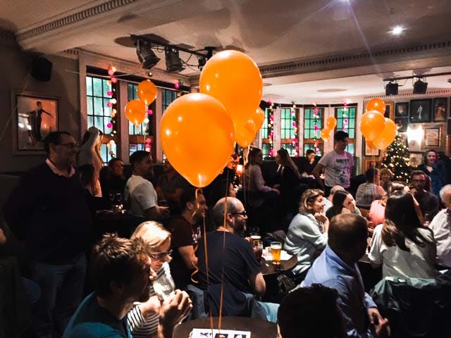 Photo of audience playing Heads and Tails