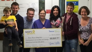Search Seven presents cheque to Trevor Mann Baby Unit from charity football match donations