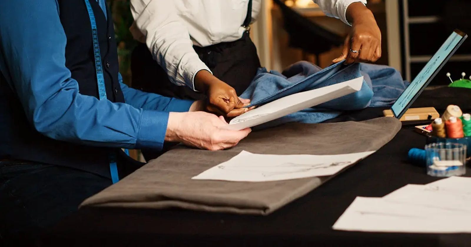 People Standing around a Table with a Piece of Fabric