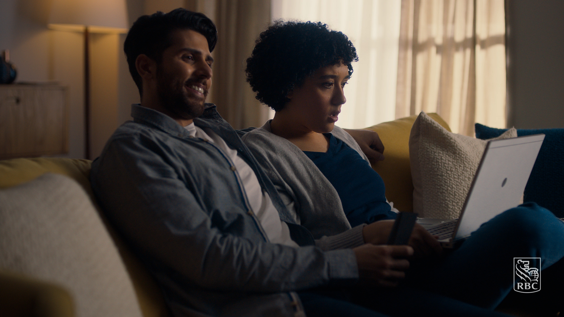 A couple on a sofa in a RBC commercial edited by Will Cyr.