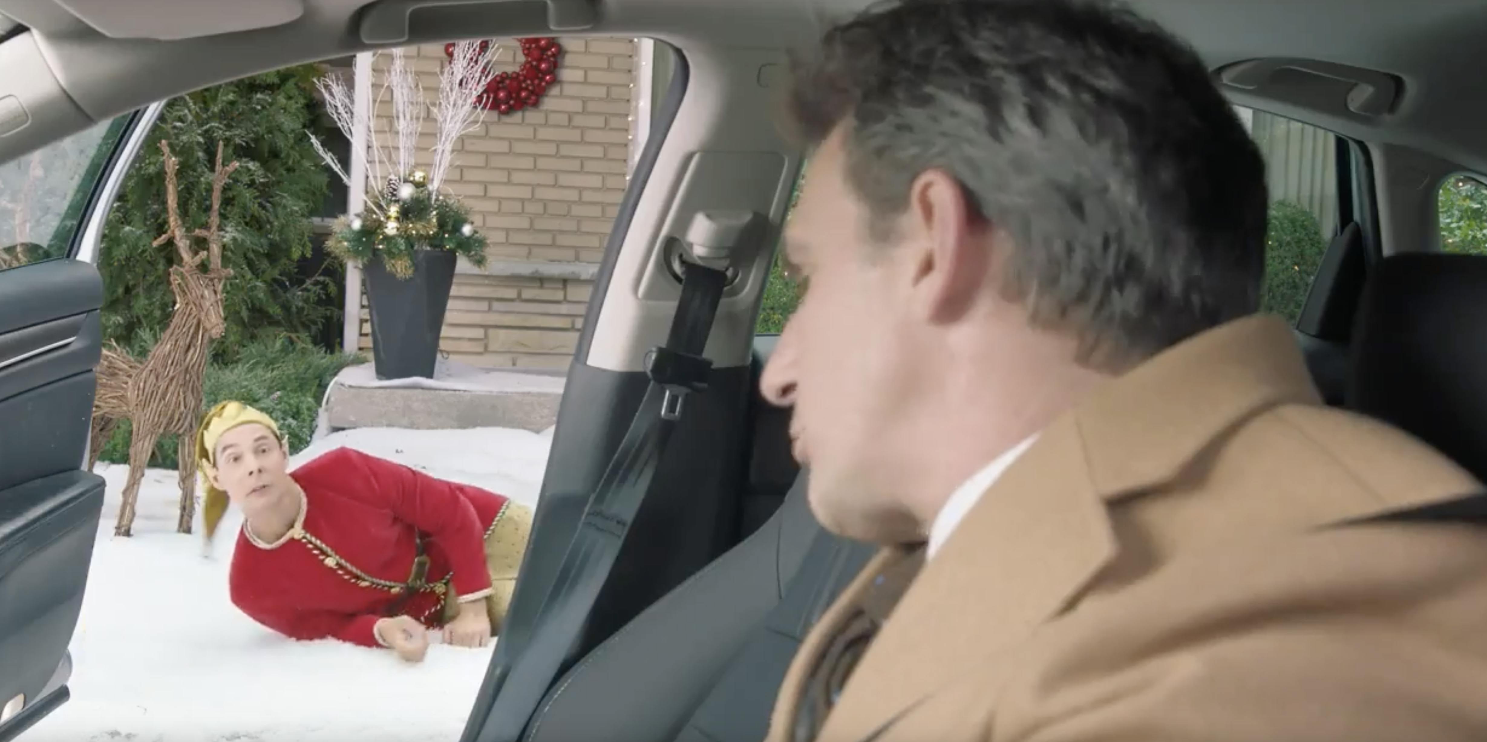 An elf looks at a man in an Honda Accord in a commercial edited by Will Cyr.