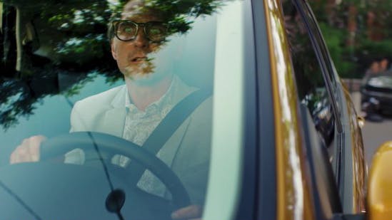 Man driving a Ford  in a commercial edited by Will Cyr.