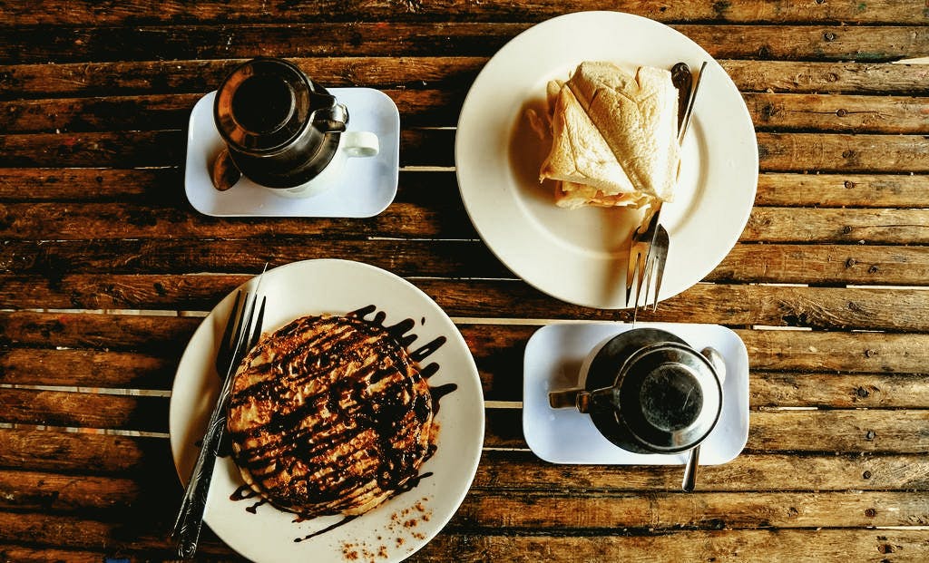Enjoy a banana pancake and local coffee at a cute Sapa cafe before you leave! 
