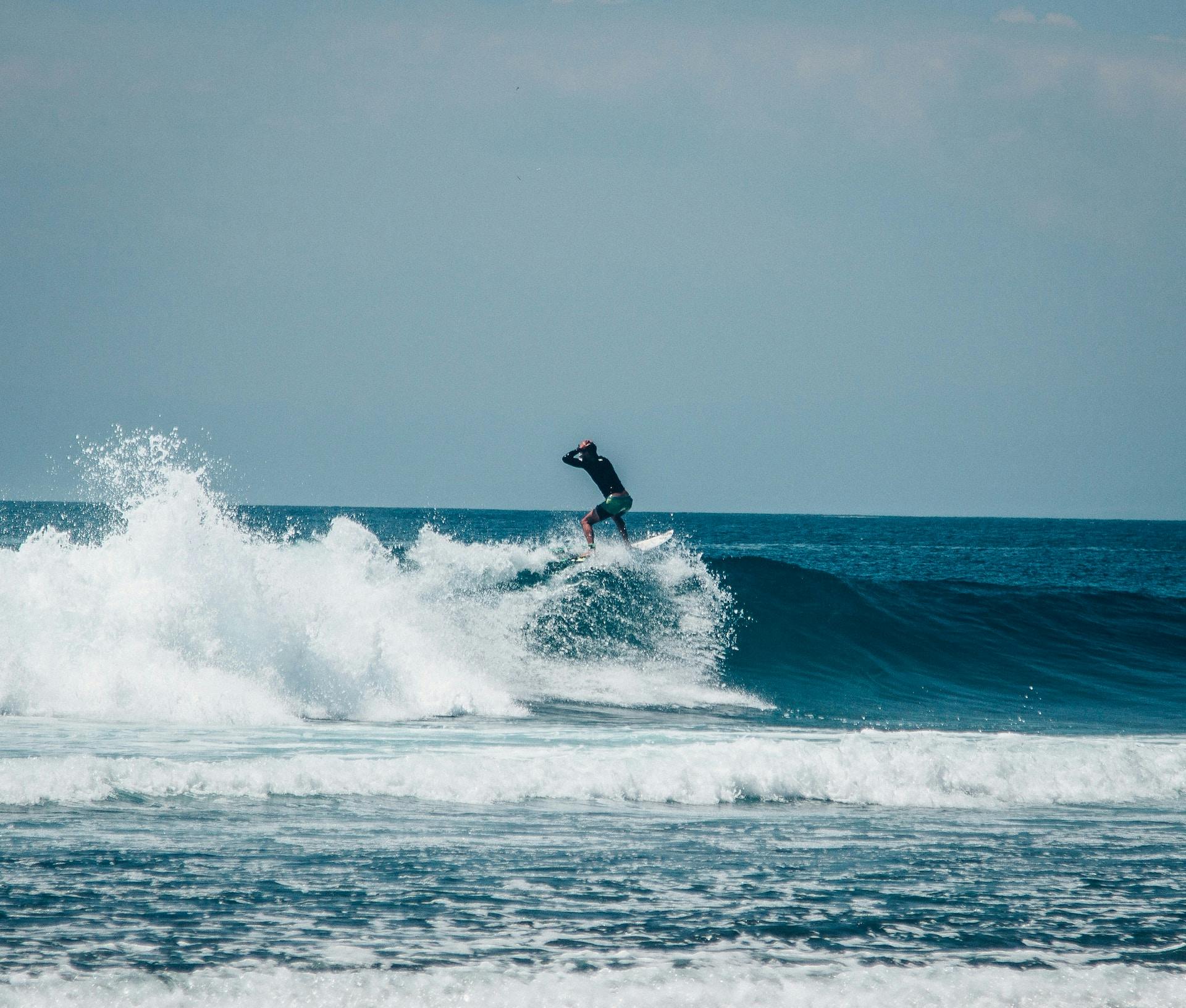 Learn to ride the waves at Uluwatu, with the best white sand beaches in Bali 