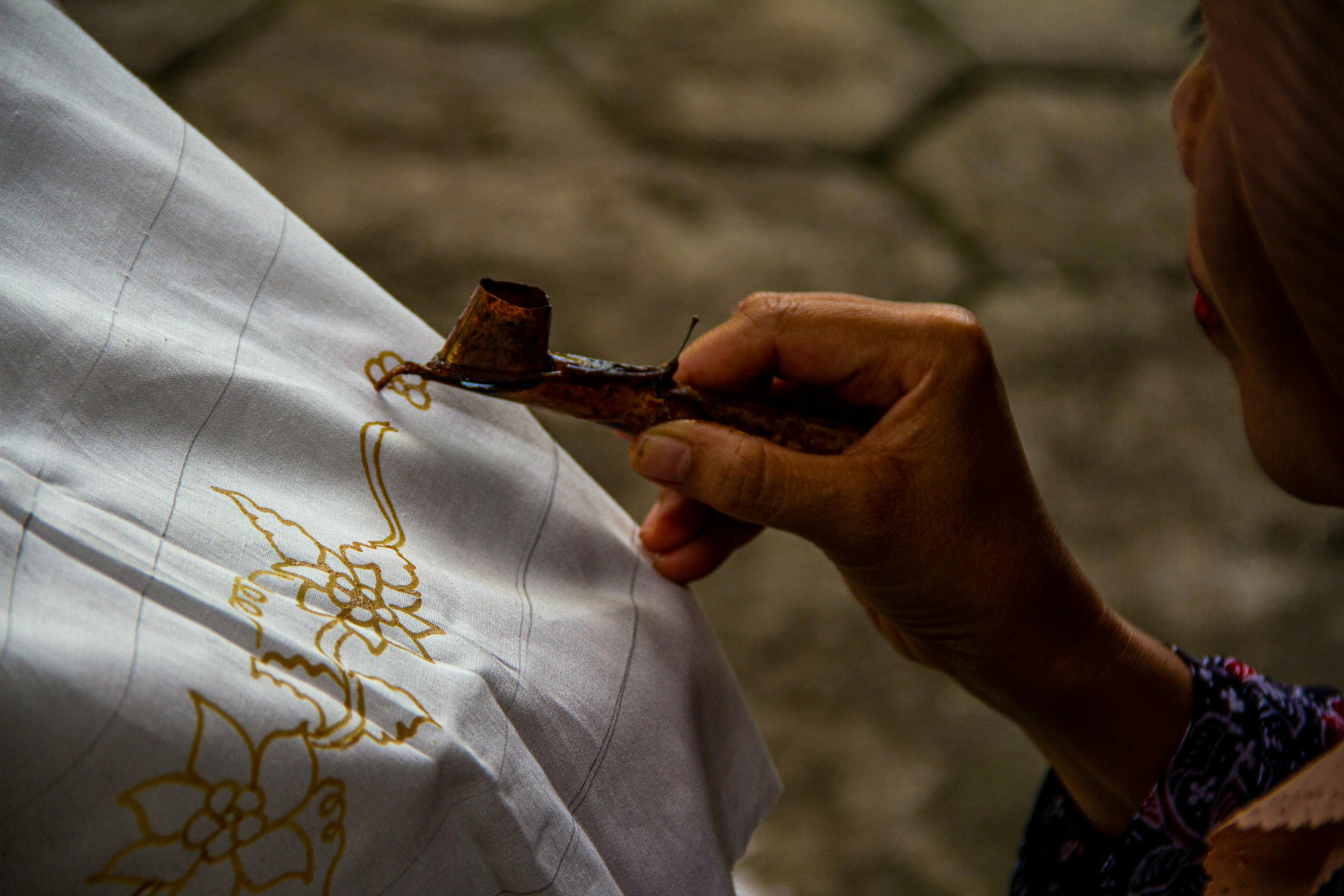Batik is the traditional art form of applying wax to create intricate patterns on clothing