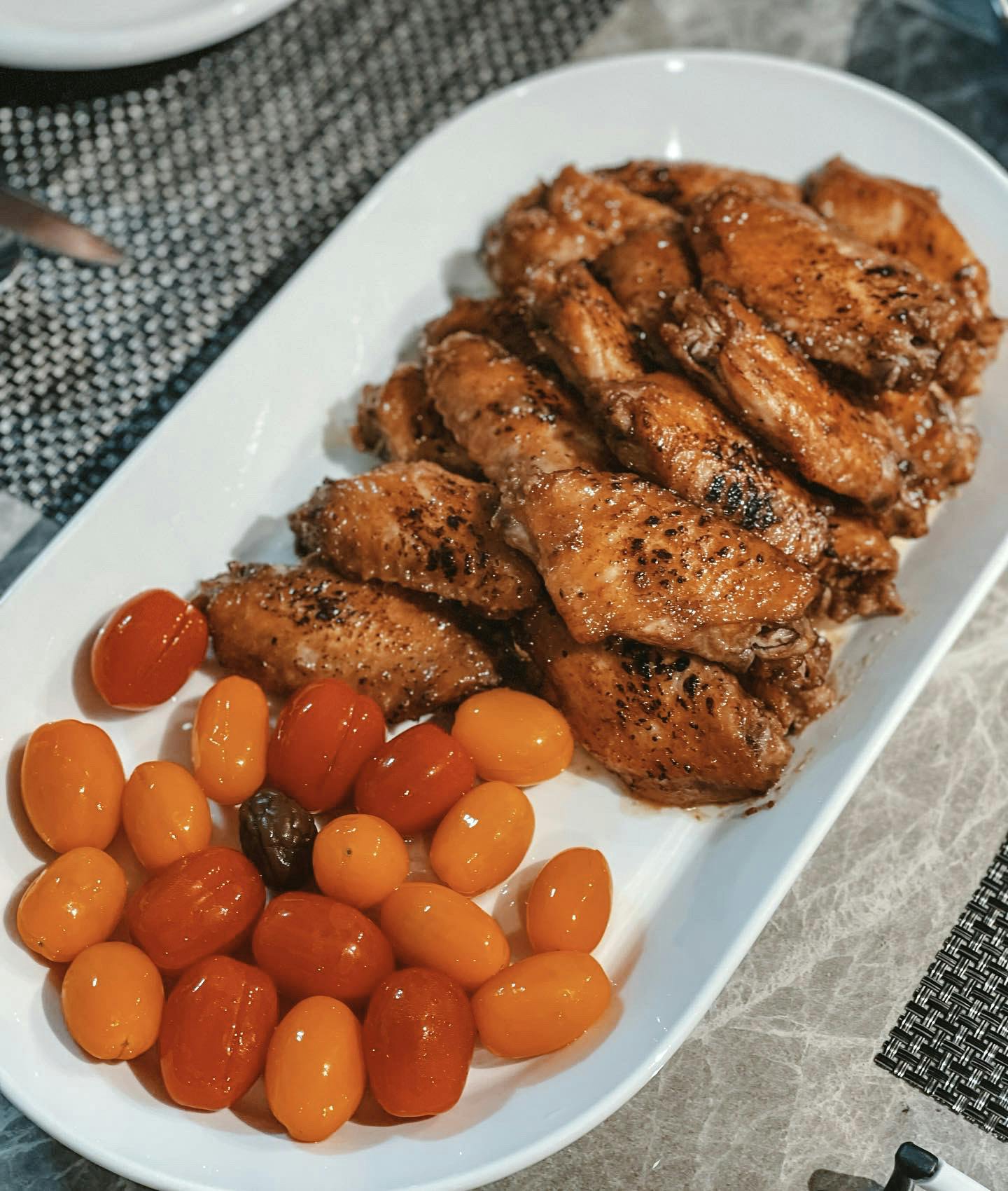 Fried chicken wings marinated in homemade pineapple sauce, and finished with a blowtorch for extra flavour