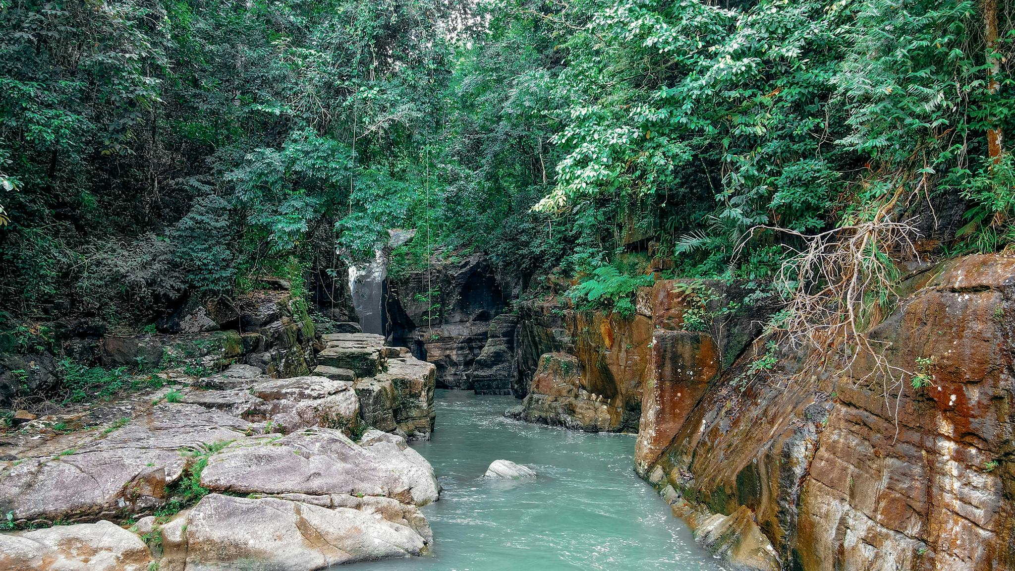 See the crystal clear waters at Cunca Wulang waterfalls