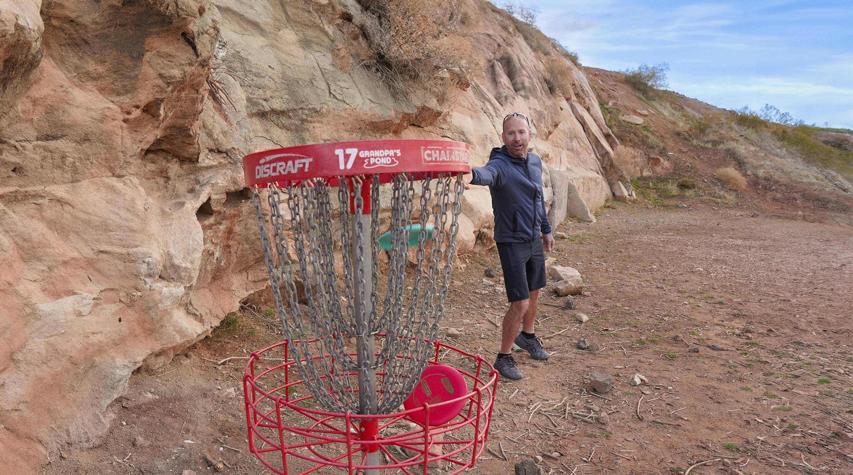 man throwing a disk in southern utah