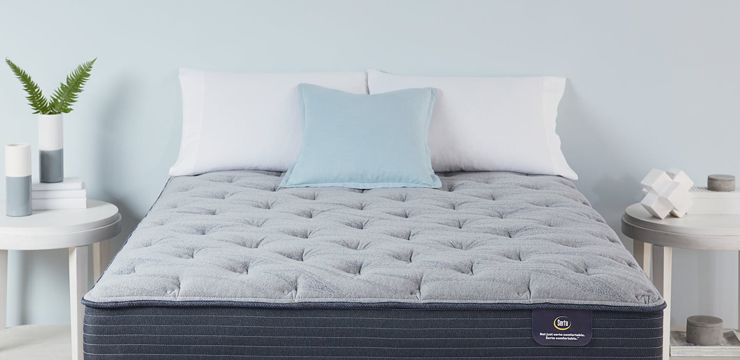 A Serta Luxe mattress in a bedroom.