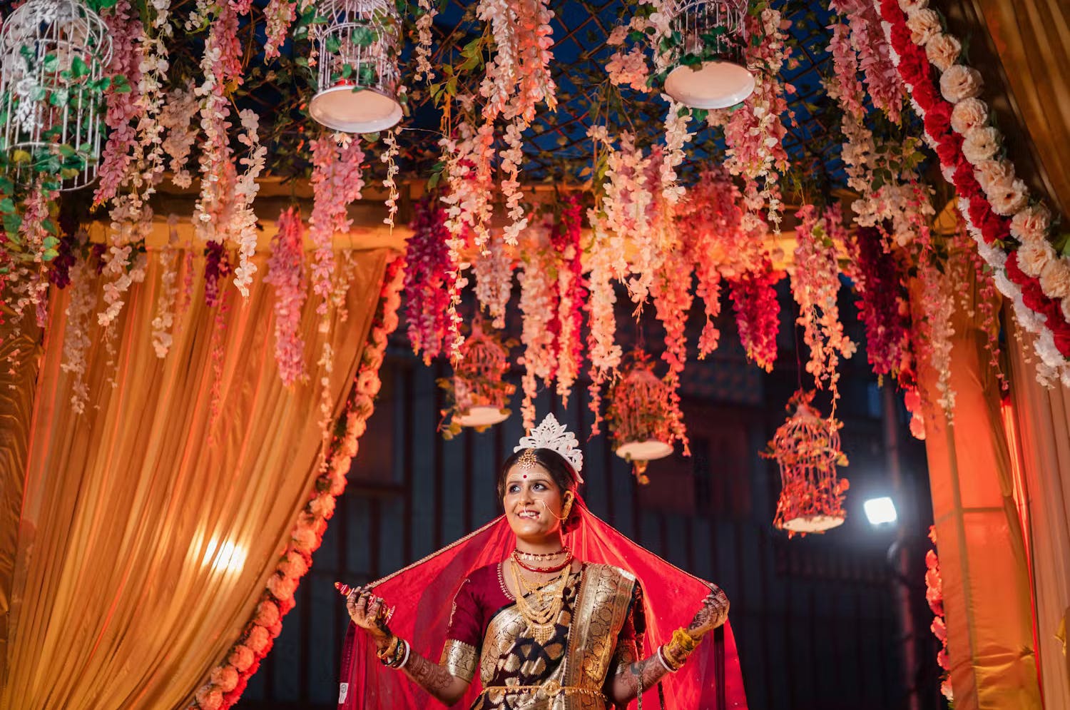 Bengali Bride Saving Her Precious Moments Under The Floral Azure
