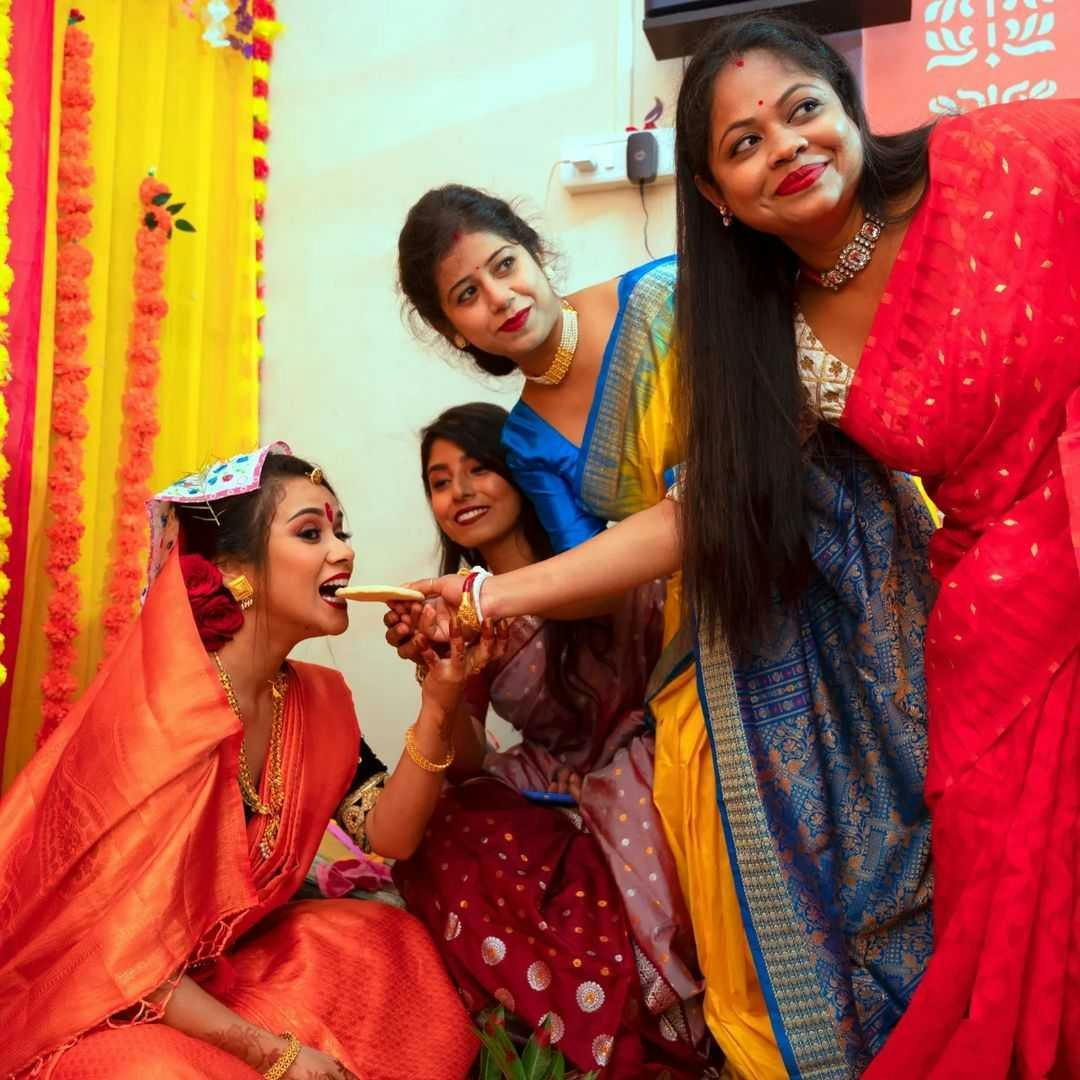 Bride getting blessings from family pic