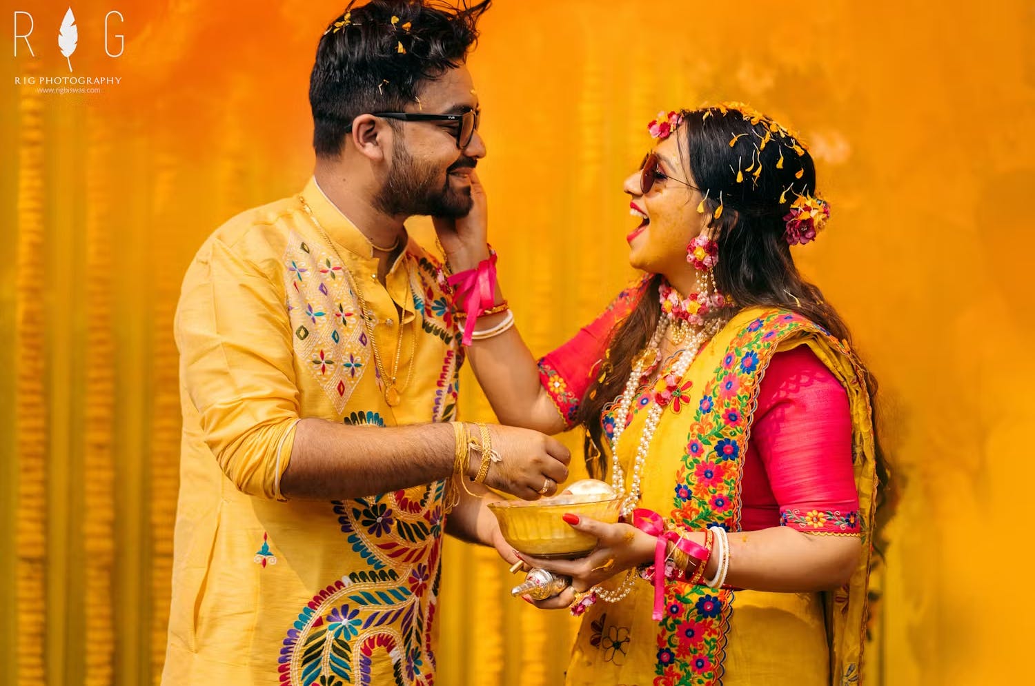 Wedding couple celebrating their Haldi ceremony