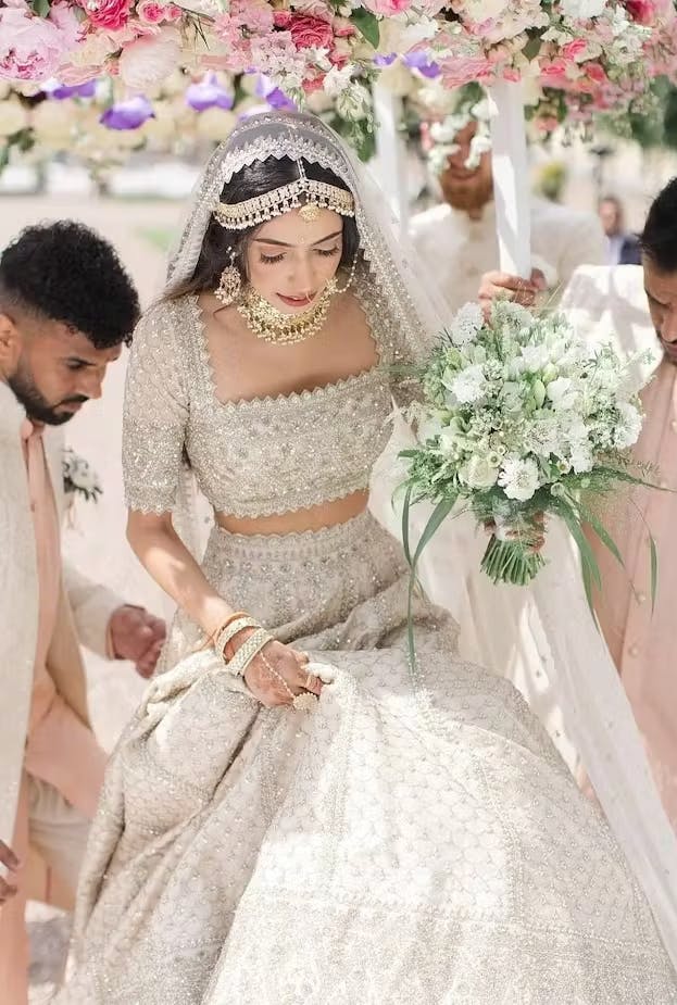 Bridal look in a beautiful ivory Lehenga choli.