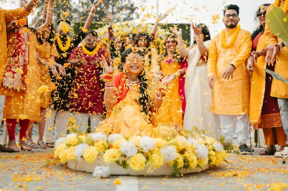 Bride drenched in flowers on haldi day