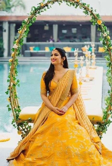 Bride in enchanting haldi pose