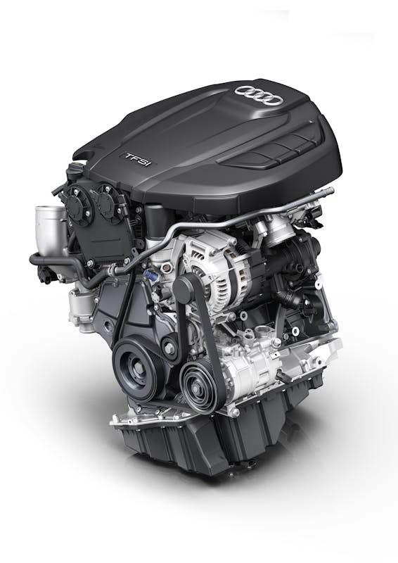 Ein moderner Audi TFSI-Motor mit sichtbaren Komponenten und einem mattschwarzen Gehäuse.